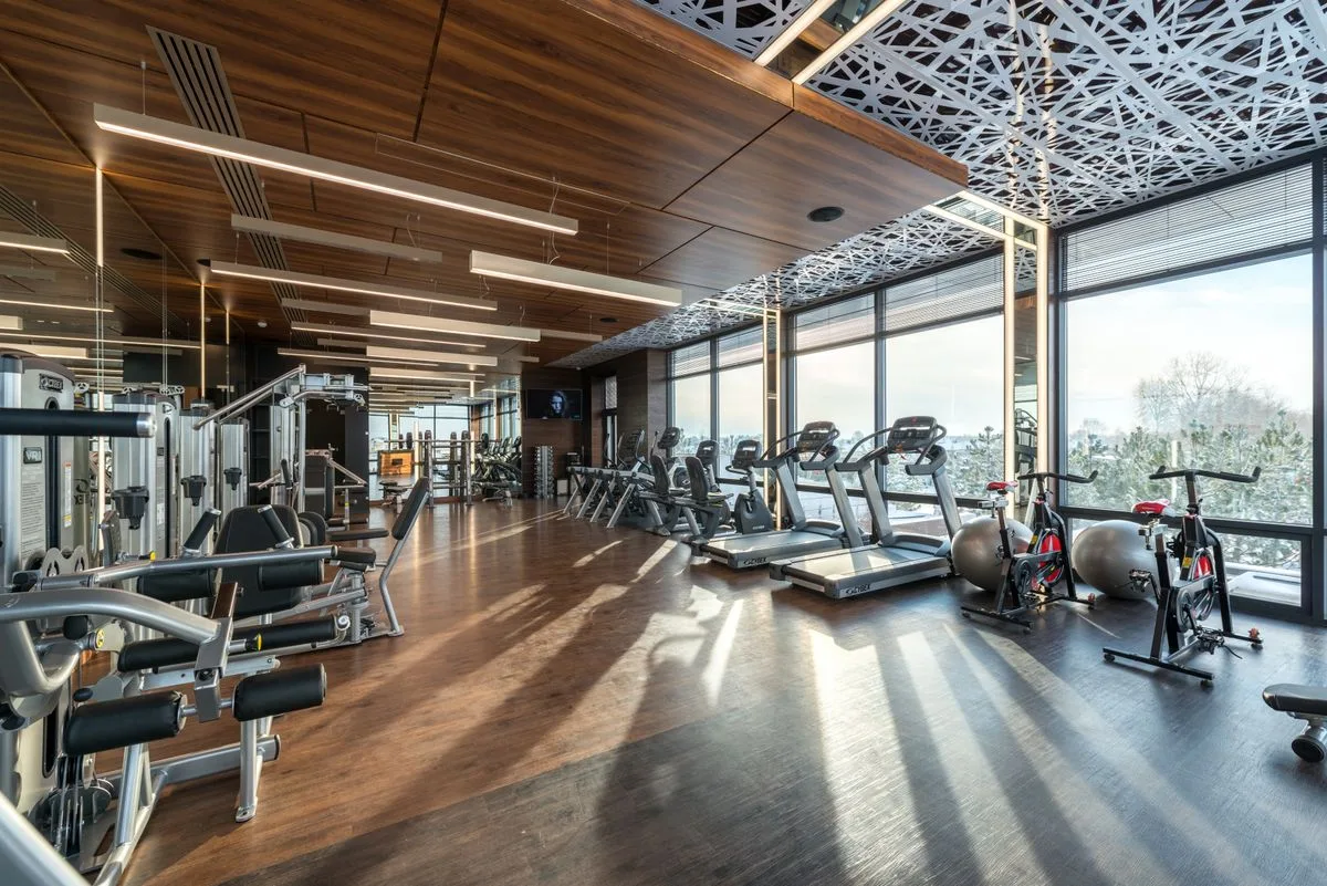 Spacious modern gym interior with cardio machines and weights — mid to premium Malta gym cost range