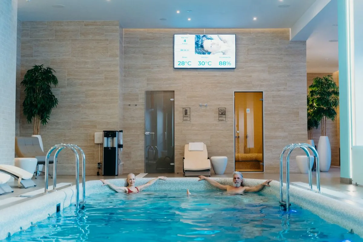 Indoor pool and recovery suite at a wellness club in Malta — beginner gym membership includes full recovery access