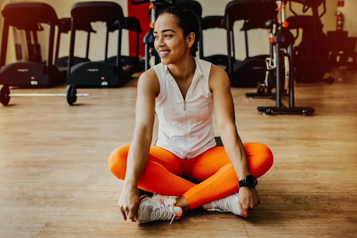 Woman working out alone in a gym during quiet morning hours, when gyms in Malta are least busy
